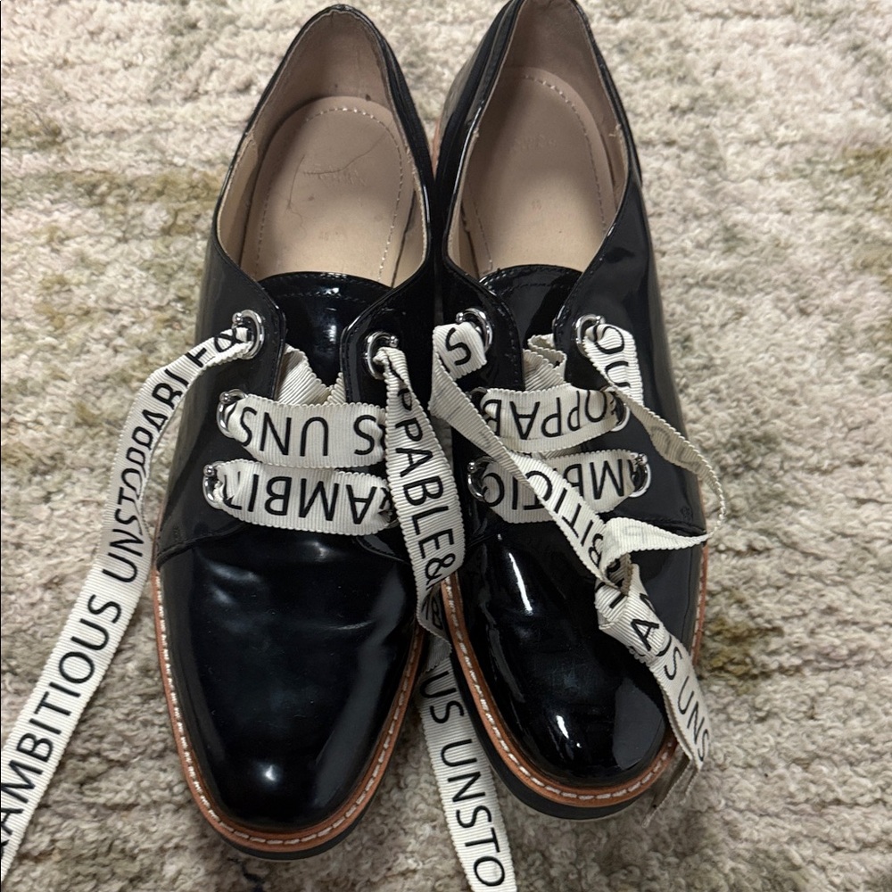 Elegant Black Patent Leather Loafers with Statement Laces